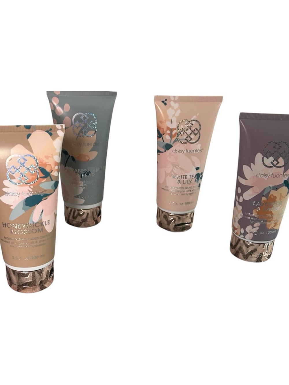 Daisy Fuentes Floral Scented Hand Cream in Pink, Gray, Peach & Purple .